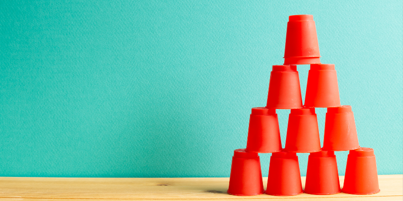 Stacked cups as a metaphor for an organization's structure.