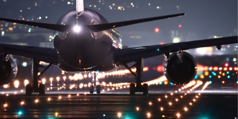 An airplane on the runway illustrates a story about necessary work becoming a positive customer experience.