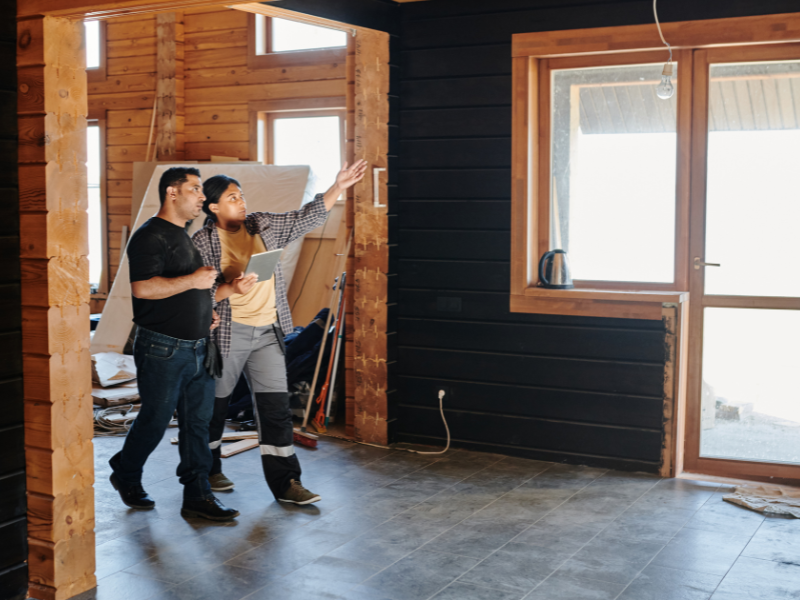 Two contractors planning for the construction of a home.