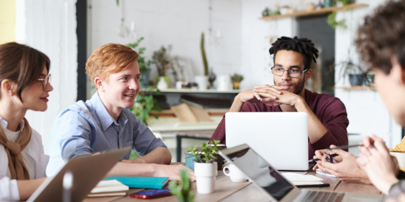 Fungible talent: employees learn how to take on new skills in a roundtable meeting.
