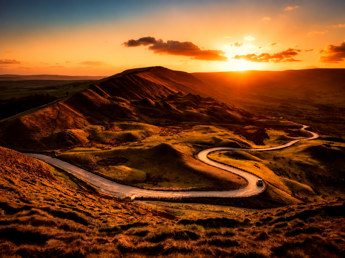 A car proceeds on a winding road